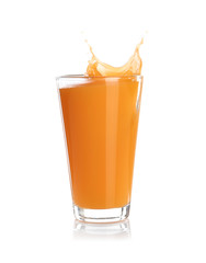 Juice splashing out of glass isolated on white