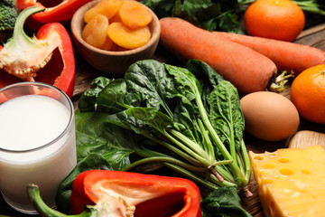 Fresh products rich in vitamin A on table, closeup