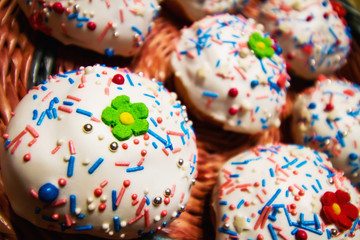 Easter cakes in a wicker basket. Homemade easter baking. Closeup, selective focus