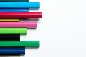 Set of coloured pencils on white