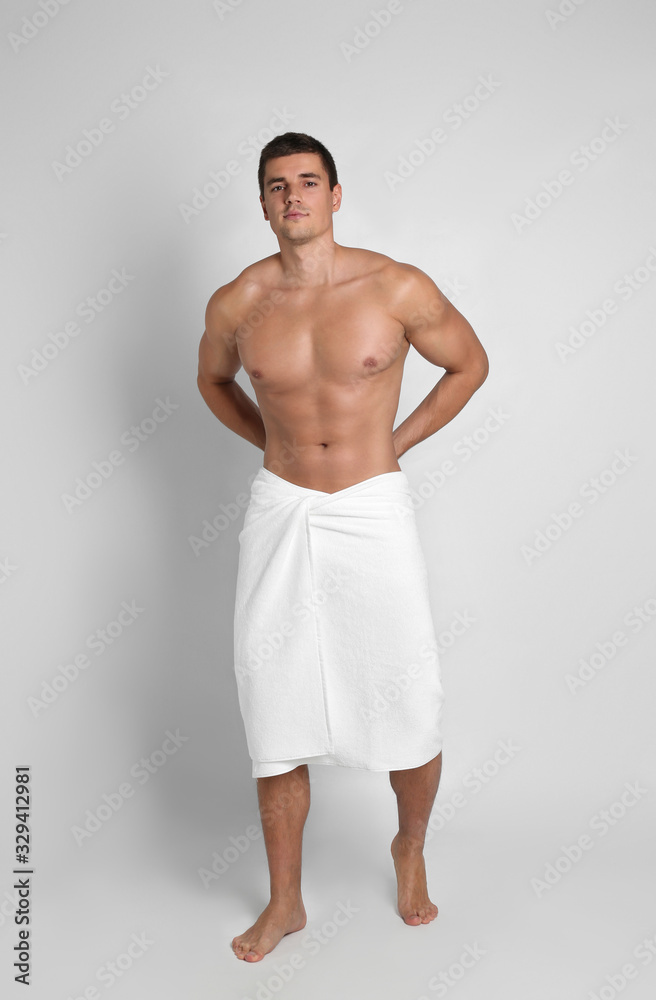 Poster Man with sexy body on light background