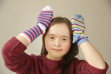Beautiful girl smiling with different socks