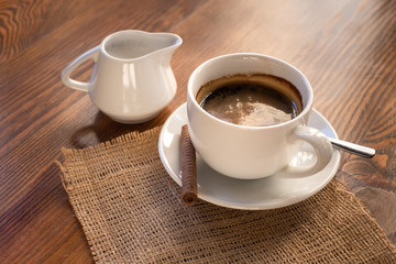 cup of coffee on wooden table