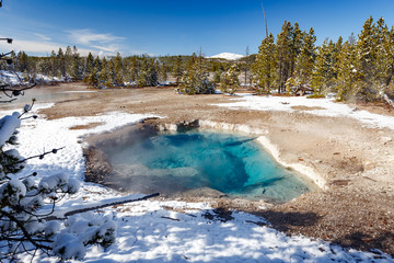 Mystic Spring at Norris Geyser Basin trail area, during winter in Yellowstone National Park, Wyoming, USA