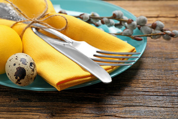Festive Easter table setting with beautiful willow branches, closeup