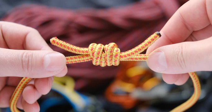 Double fisherman bend (knot) on a 5mm rope Prusik loop, used in climbing as a friction hitch - close up. Also used in canyoneering, mountaineering, caving, rope rescue, ziplining, and by arborists.