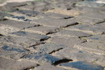 Close up picture of an old cobblestone / paving street,  background