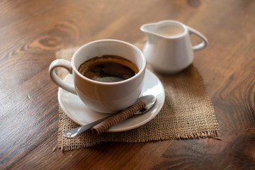 cup of coffee on wooden table
