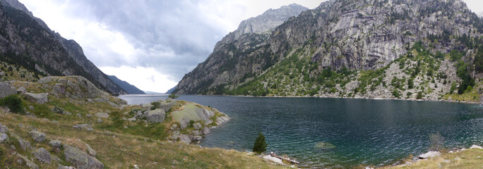 Panoramic view of the Cavallers Reservoir and the groundhog route. Aigüestortes National Park and Lake Sant Maurici, the Pyrenees Mountains, Catalonia