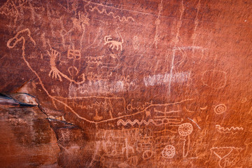 Native American petroglyphs - art drawings, estimated to be over 4000 years old, at Atlatl Rock, Valley of Fire State Park, Nevada, USA