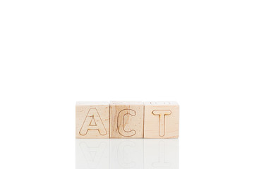 Wooden cubes with letters act on a white background