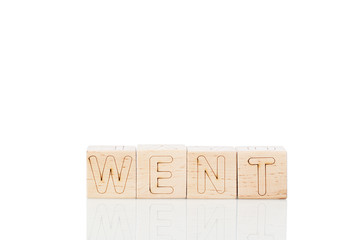 Wooden cubes with letters went on a white background