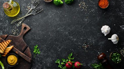 Black stone banner of food, vegetables and spices. Background of cooking.