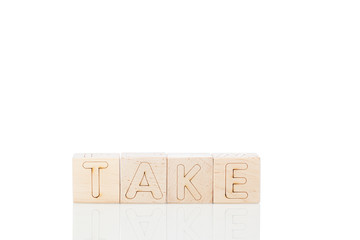 Wooden cubes with word take on a white background