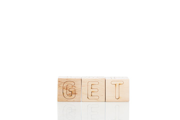 Wooden cubes with word get on a white background