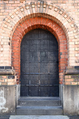 Fototapeta na wymiar old building with iron door entrance detail