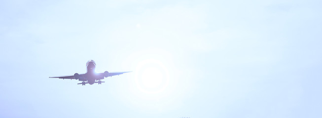 Airliner in the sky. The sun is shining