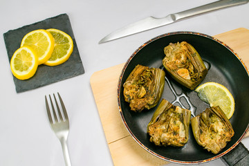 roasted gourmet artichokes with lemon ready to eat