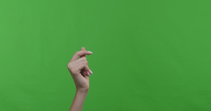 Woman snapping her fingers over chroma key background