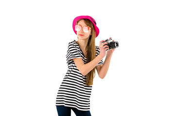 Portrait of smiling girl in striped summer casual clothes,red hat with photo camera isolated on white background. Female passenger traveling abroad to travel on weekends getaway.Journey concept.