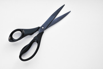 The black scissors isolated on white background