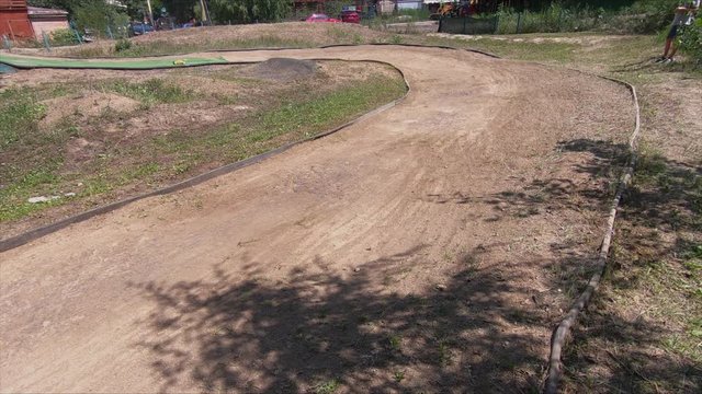 Remote racing cars on sandy road turning left. Toy vehicles on high speed.
