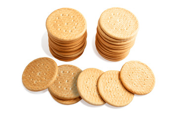 Wheat round cookies on a white background. Biscuits on the table. Morning breakfast cracker snack. Wheat light meal snack in lunch time.
