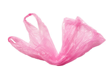 Pink plastic bag with handles isolated on a white background. The used plastic bag may be recyclable. Recycling of plastic waste into pellets as a business.