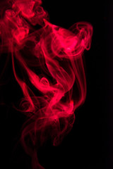 Red smoke on black background