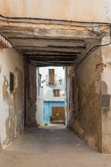 Narrow and old alley in Chelva, valencian community, Spain