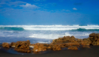 Fototapeta na wymiar waves crashing on a rocky beach