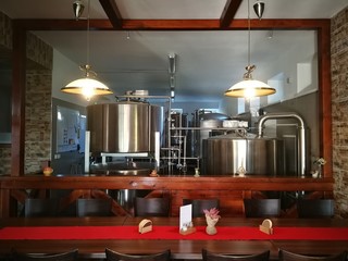 Fototapeta na wymiar Beer making facilities, small brewery and tasting table