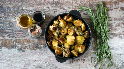 Baked Brussels sprouts with rosemary and spices. Frying pan with baked brussels sprouts.