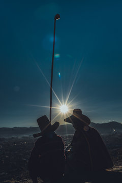 father and son silhouette at sunrise
