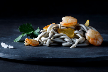 Angula with prawn and parsley