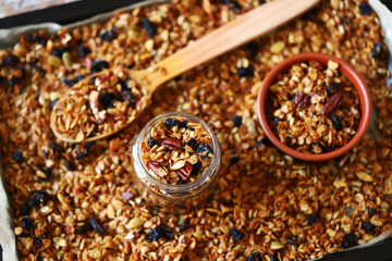 Selective focus. Fresh homemade granola. Healthy breakfast or snack. Cooking granola.