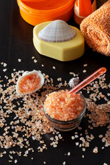 Pink Himalayan salt crystals shell soap towel. Spa set. Dark background, Selective focus.
