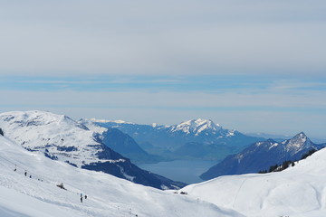 Skiing slopes of Hoch Ybrig skiing resort Switzerland with view on Lake Lucerne