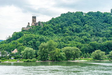Fototapeta na wymiar Germany, Rhine Romantic Cruise, a large body of water surrounded by trees