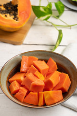 Papaya fruit cutted on white background