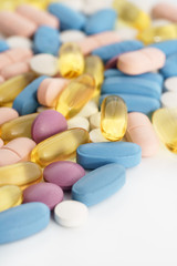 Macro shot of different pills and vitamins on white background. High resolution, isolated