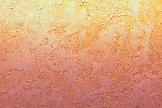 Texture of decorative plaster, peach color background, copy space