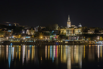 Fototapeta na wymiar Belgrade on the water during night time