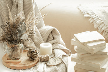 Fototapeta na wymiar Home interior with books and dried flowers.