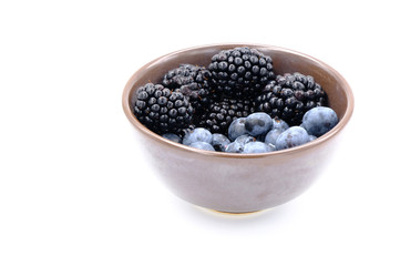Blueberry and Blackberry on blown cup with white background, fruit concept