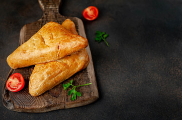 Asian food. Samsa on the chopping blackboard on background stone, with copy space for your text