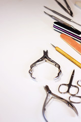 Professional manicure and pedicure instruments. Ready-made template on the theme of tools for edged, hardware, European, combined manicure.