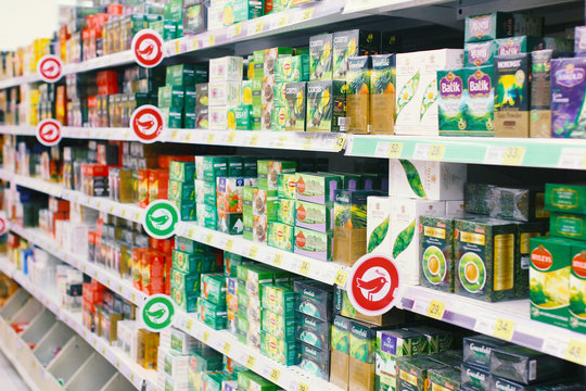 Kiev, Ukraine - January 22, 2019.  Lots of tea packs on shelves in the Auchan store. Auchan is a network of supermarkets.