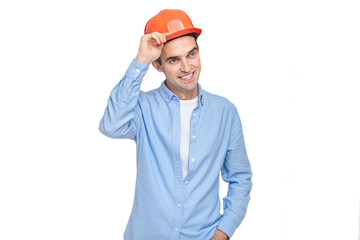 Builder takes off his helmet and smiling, isolated background, copy space