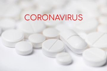 Pills with coronavirus inscription. Concept novel coronavirus 2019-nCoV. Chinese coronavirus outbreak.